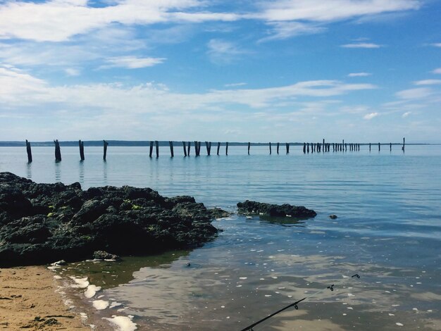 Bridge over sea against sky