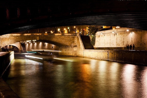 Bridge and Seine river at night Paris