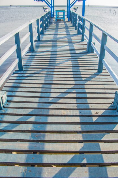 Photo bridge spanning the sea