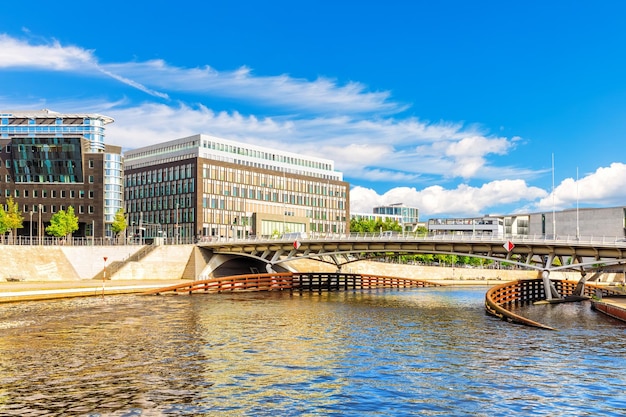 Bridge over the spree and view on the modern buildings of berlin germany