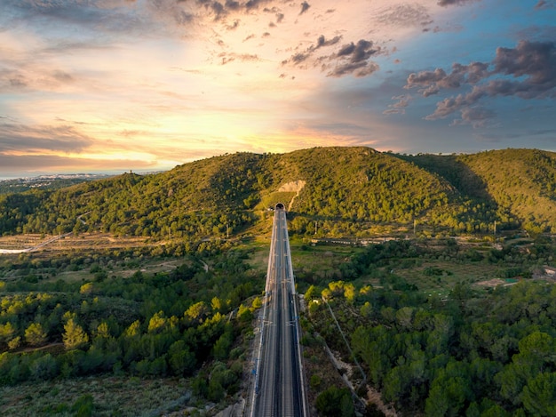 Bridge with railroad against mountains