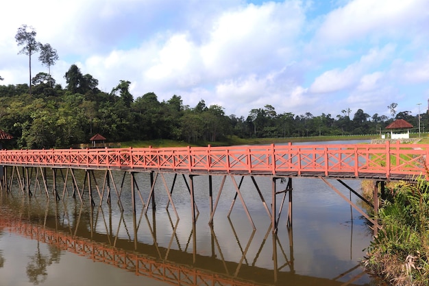 a bridge with a red bridge in the middle of it