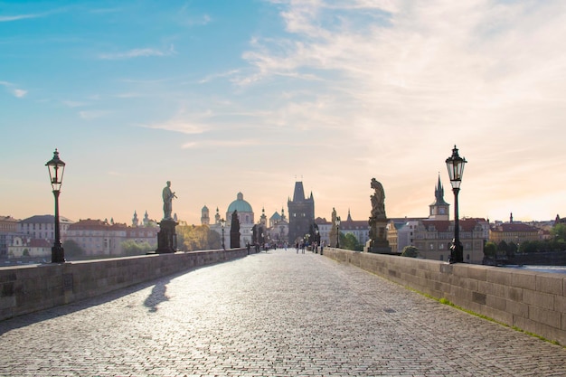 A bridge with a view of prague in the background