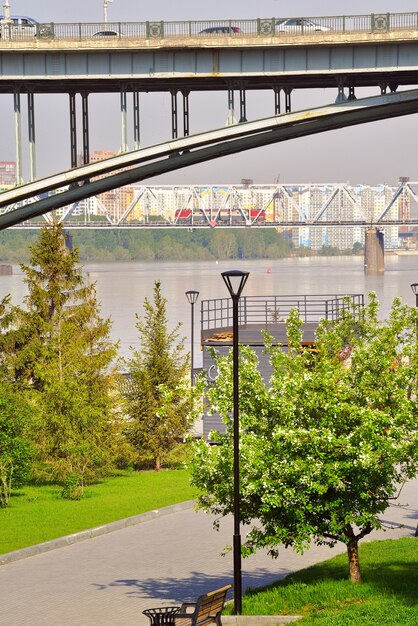 Bridges over the Ob River in Novosibirsk Green embankment of the city in the spring