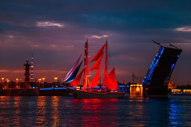 Brig with scarlet sails near the open Palace Bridge White Night St Petersburg Russia June 24 2022