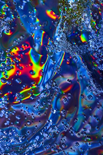 bright abstract art with bubbles flowing across colorful oily surface background asset