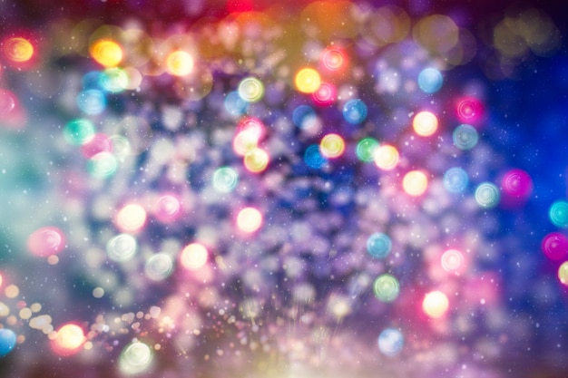 Bright abstract circular bokeh background blur on a dark background