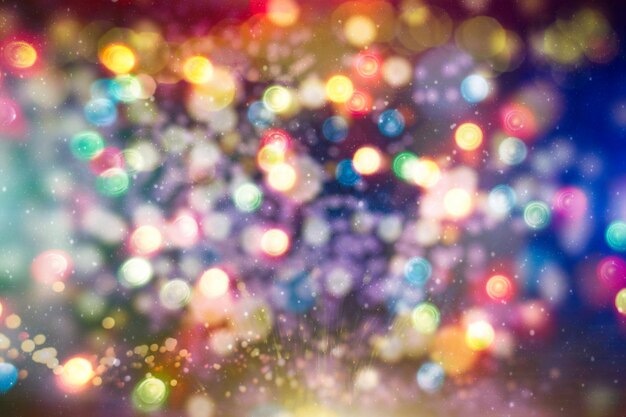 Bright abstract circular bokeh background blur on a dark background