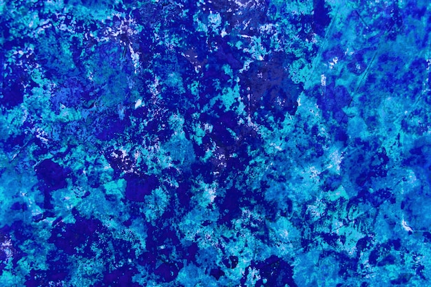 Bright abstract paint background in blue and its shades