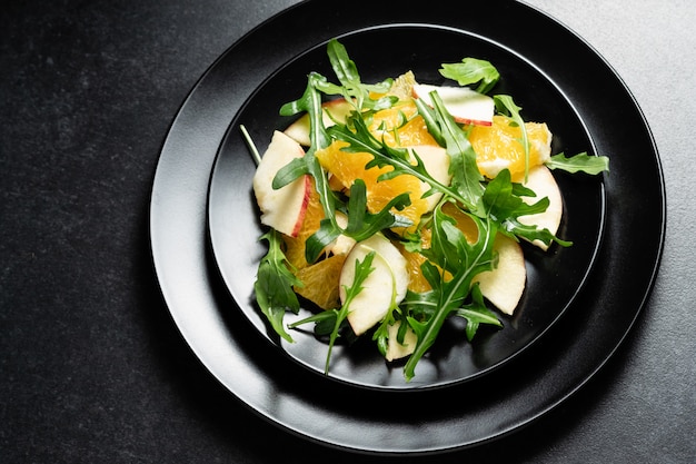 Bright, aromatic fresh salad of fruits and arugula