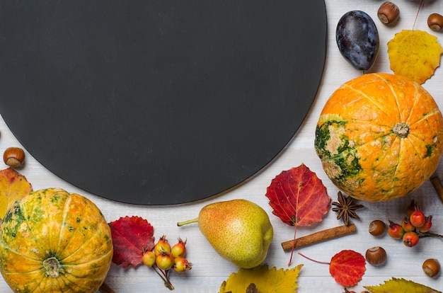 Bright autumn background with chalk board. Flat lay.