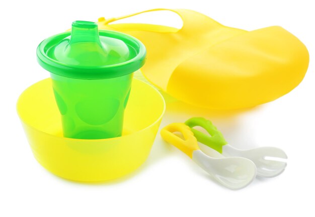 Bright baby tableware on white background