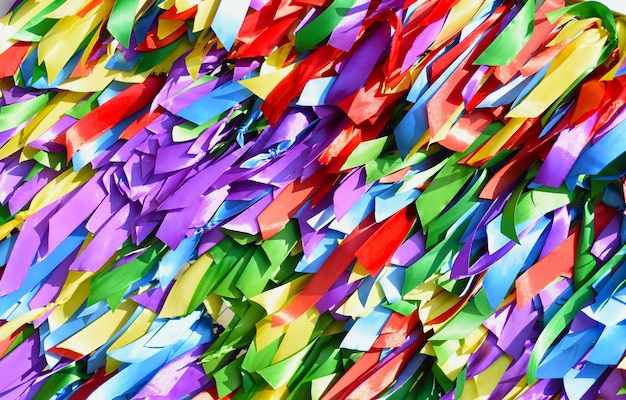 Bright background made of multicolored satin ribbons