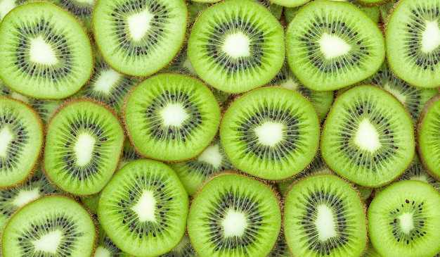 Photo bright background with slices of green kiwi