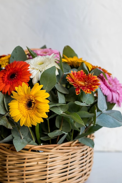 Bright beautiful bouquet with yellow orange and red flowers daisies fragment closeupfloral texture m