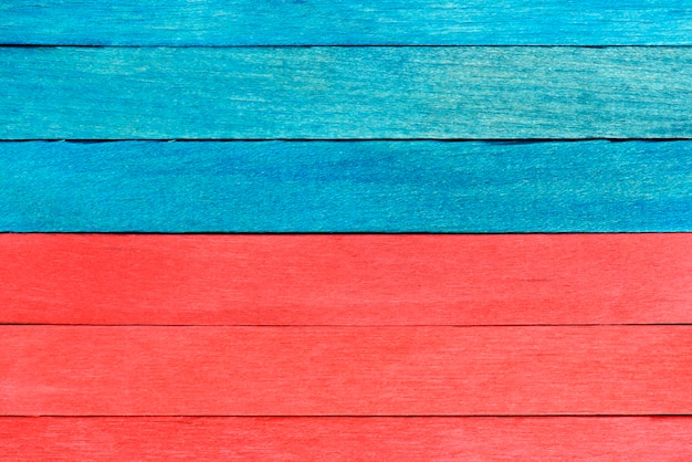 Bright bicolor background from red and blue wooden planks