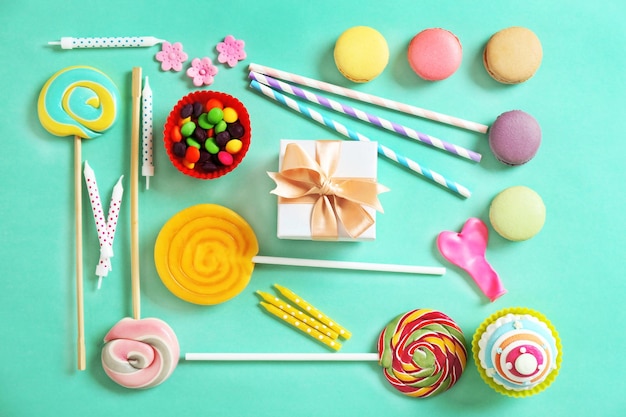 Bright birthday background with sweets and decorations