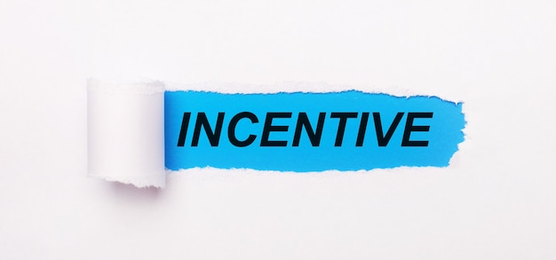 On a bright blue background, white paper with a torn stripe and the text INCENTIVE