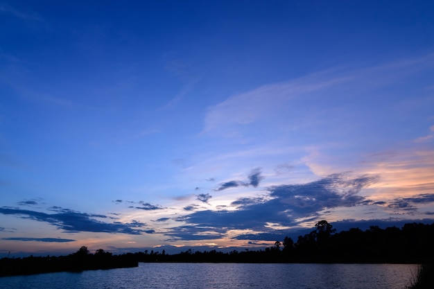 Bright blue sky with fluffy clouds at down