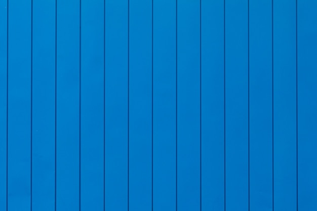 Bright blue wall with vertical panels