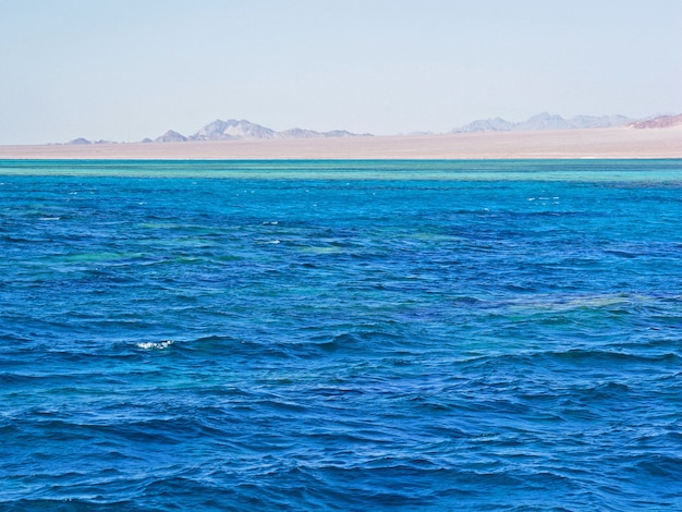 Bright blue waves on sea water surface