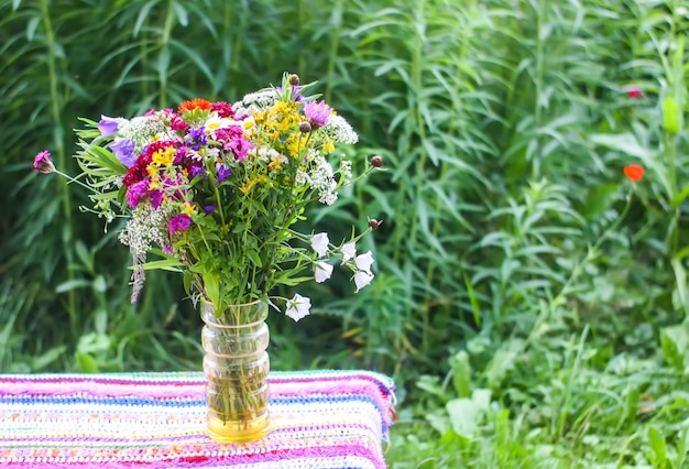 Bright bouquet of beautiful garden flowers and wildflowers