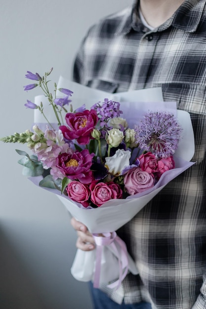 Bright bouquet of flowers in hands