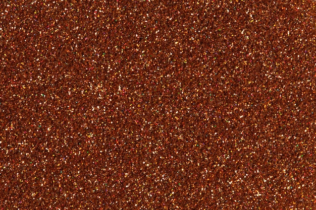 Bright brown glitter texture. High resolution photo.