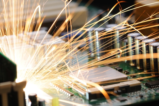 Bright burning sparks fly from the equipment of controller chip