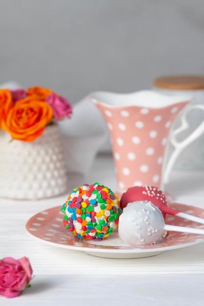 Bright cake pops dessert on the table. Festive good mood