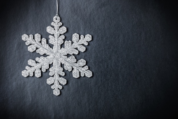 Bright Christmas snowflake on black background