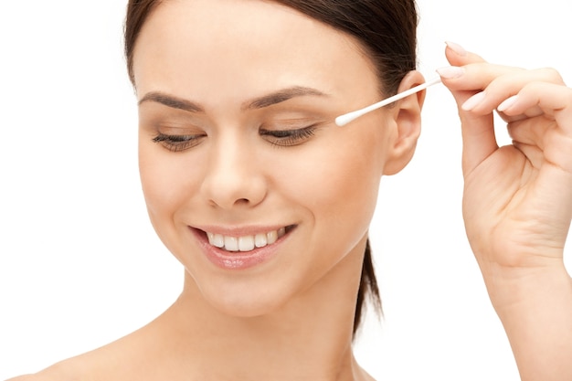 bright closeup portrait picture of beautiful woman with cotton bud