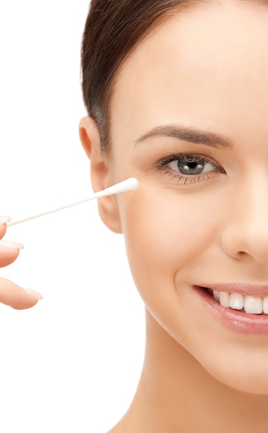 bright closeup portrait picture of beautiful woman with cotton bud