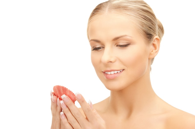 bright closeup portrait picture of beautiful woman with seashell..