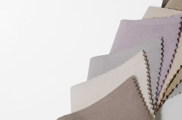 Photo bright collection of velour textile samples. fabric texture background.