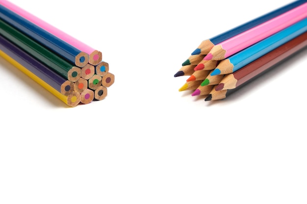 Bright colored pencils on a white background.School supplies for drawing.