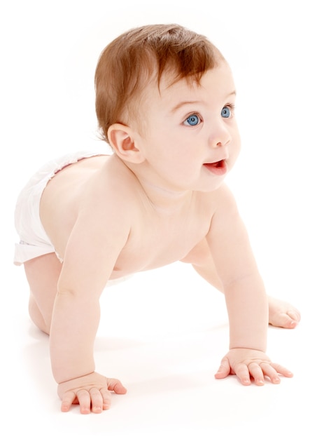 bright crawling baby boy in diaper