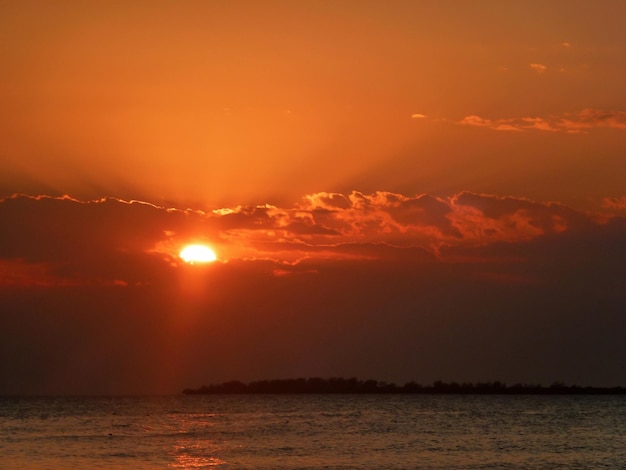 Bright crimson sunset over the evening sea