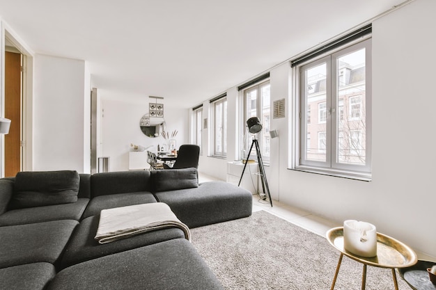 Bright diningroom with grey sofa