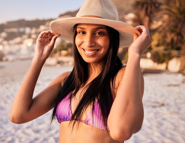 Bright and early Shot of a beautiful young woman enjoying some time at the beach