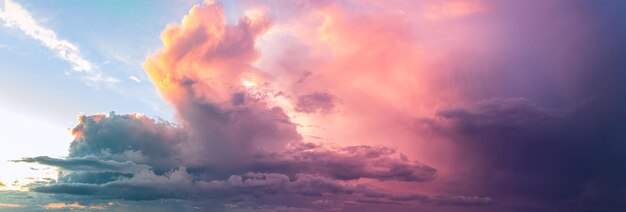 A bright fabulous and intense sunset with large clouds. Rainy sky at the end of the day