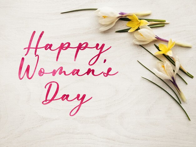 Bright flowers and Happy Women's Day lettering. Close-up, no people. Congratulations for family, relatives, friends and colleagues