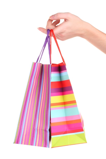 Bright gift bags in handd on white