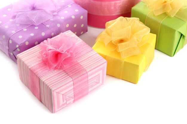 Bright gifts with bows isolated on white