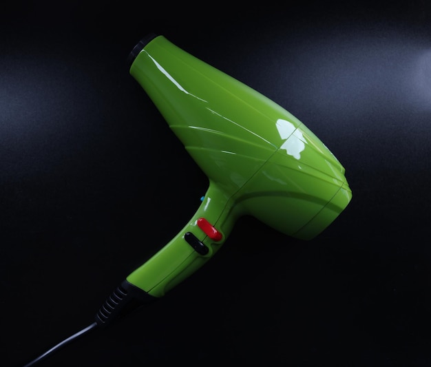 Bright green background on black background reliable hair dryer for home use