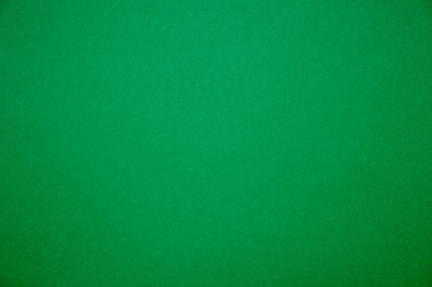 Bright green background.Red cardboard texture.