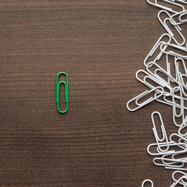 Photo bright green paper clip concept