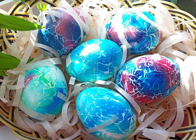 Bright handpainted easter eggs in basket