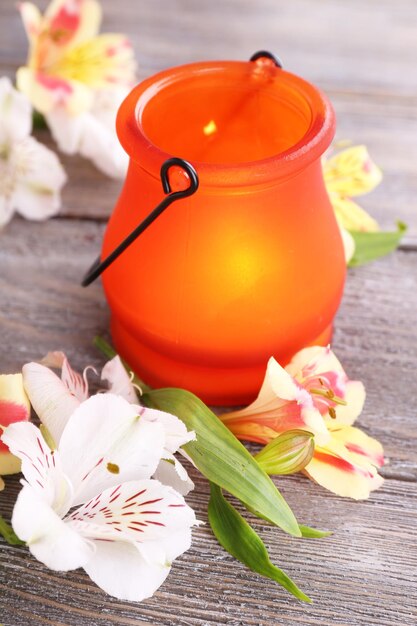 Bright iconlamp with flowers on wooden background