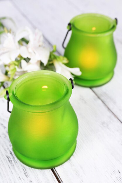 Bright iconlamps with flowers on wooden background